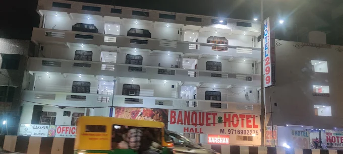 Darshan Hotel & Banquet Hall exterior at night